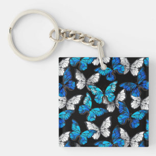Motif sans couleur foncée avec papillons bleus Mor