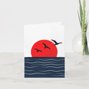Mouettes sur carte avec soleil rouge dans l'océan
