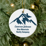 Mountain Real Estate Company Custom Christmas Ceramic Ornament<br><div class="desc">A cool mountain range real estate company Christmas ornament for a realty business located in a mountainous city or town. The realtor name is written in navy blue script under the house among mountains. Great marketing item for a mountaintop home builder.</div>