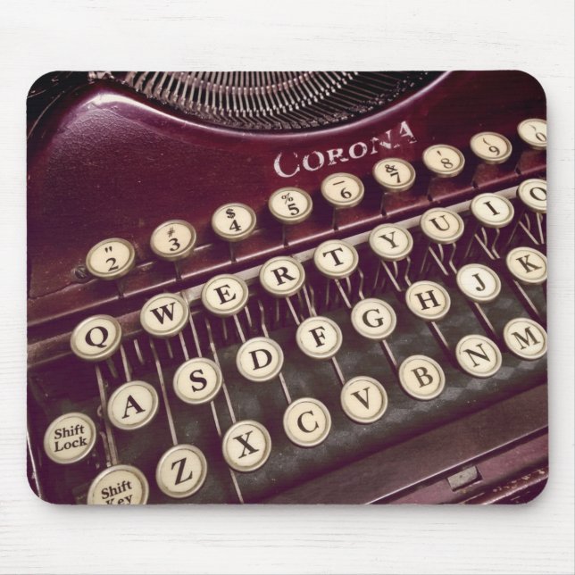 Mouse roams over a classic typewriter mouse pad (Front)