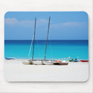 Mousepads with a picture of boats on a beach