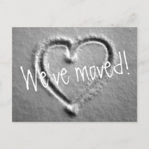 Moving postcards with drawn heart in snow