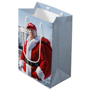 Moyen Santa Claus Trump avec le sac cadeau rouge