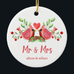 Mr and Mrs Cardinal Lovebirds Personalized Ceramic Ornament<br><div class="desc">Decorate your tree with this "Mr and Mrs" design, featuring a pretty watercolor of two red cardinals. The lovebirds are face to face, perched on seasonal evergreens with a heart in between them. Underneath "Mr and Mrs" is written in fun modern typography and you can personalize with the couple's first...</div>