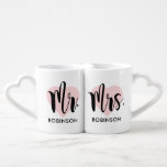 Mr and Mrs Pink Heart Custom Wedding Monogram Coffee Mug Set<br><div class="desc">Personalized monogram coffee mugs make a unique wedding gift for the new Mr and Mrs! This minimalist design features modern black script writing,  a pink heart background,  and custom text that can be personalized with the newlywed couple's married last name.</div>