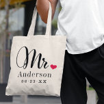 Mr. Black Script Married Monogram Wedding Tote Bag<br><div class="desc">Personalized tote bags for the newly married Mr. and Mrs. feature elegant black script and custom last name and wedding date monogram text that can be personalized. Design includes a cute red heart detail. Makes a great wedding gift! Shop our store for the coordinating Mrs. bag design.</div>