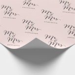 Mr & Mrs Classic Script Calligraphy Name Wedding Wrapping Paper<br><div class="desc">A modern classic and simple 'Mr. and Mrs.' black calligraphy script design with names that can be personalized, on a sweet pastel blush pink background. This custom wrapping paper is great for wedding favours, wedding parties, engagement and couples showers. The base background can be changed to any colour of your...</div>