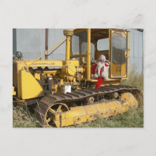 Ms Ella checks out farm equipment Postcard