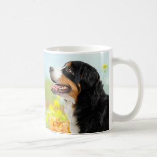 Mug Bernese Mountain dog in the flower garden