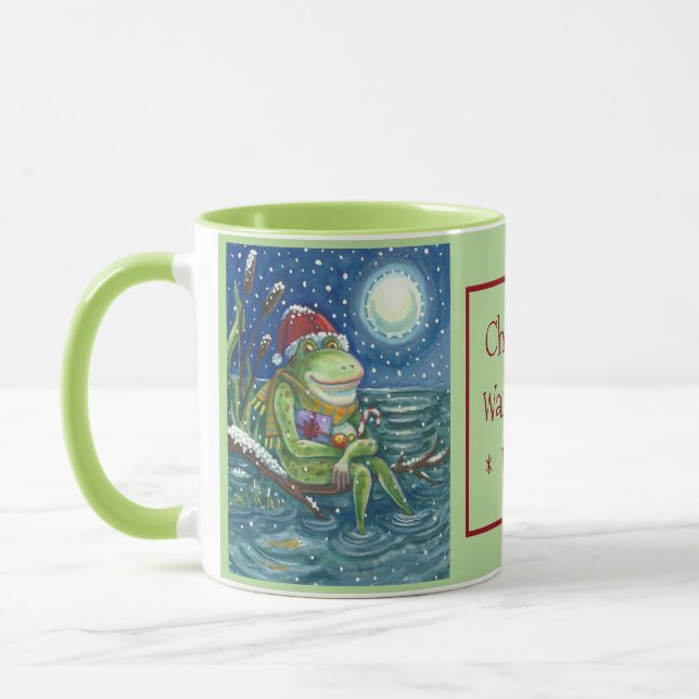 MUG FROG PÈRE NOËL SUR JOURNAL, VACANCES ANIMAL NOËL M (Gauche)