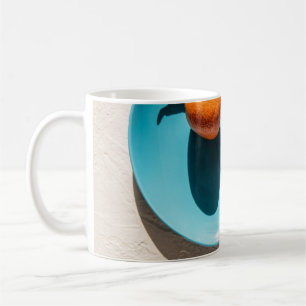 Mug Fruit orange dans l'assiette