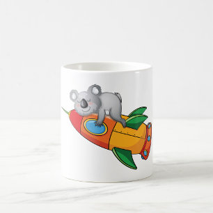 Mug Koala dormant sur une fusée colorée