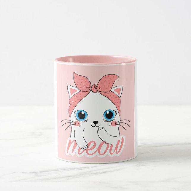 Mug Meow Cat (A white mug with a pink interior and a pink exterior features a cartoon illustration of a white cat.)