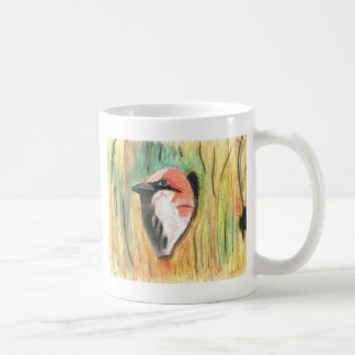 Mug moineau faisant une pointe d'un empilage