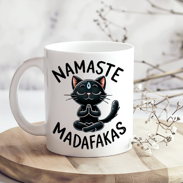 Mug "Namaste Madafakas" Amusants Amoureux de les chats ("Namaste Madafakas" Funny Cat Lovers Coffee Mug on a boho kitchen table with tiny white flowers)