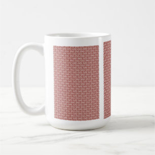 Mug Tissus rouges et roses posés sur un tapis à motif 