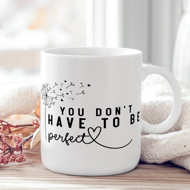 Mug "Vous n'avez pas besoin d'être parfait" Dandelion ("You Don't Have to Be Perfect" Dandelion Coffee Mug on a boho wooden table with pink flower.)