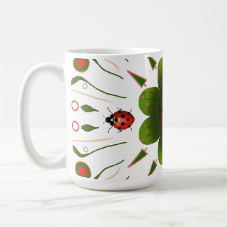 Mug with ladybug design, red & green on white.