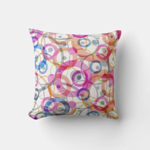Multi-coloured polka dots, circles on a white throw pillow