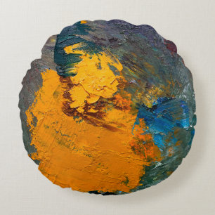 multi-coloured strokes of oil paint on the artist' round pillow
