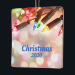 Multi-coloured Twinkle Light, Christmas 2020 Ceramic Ornament<br><div class="desc">Multi-coloured Twinkle Light, Christmas 2020 Ceramic Ornament - Multi-coloured Twinkle Lights, with a beautiful boken of lights shining all around with Christmas 2020 as the message. This is completely customizable and can be changed to anything you'd like. On the back is a place for your own photo. Happy Holidays and...</div>