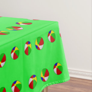 Multicolor beach ball on green tablecloth