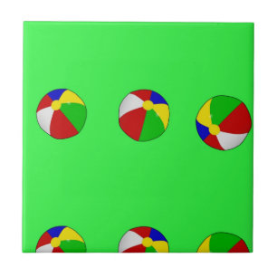 Multicolor beach ball on green tile