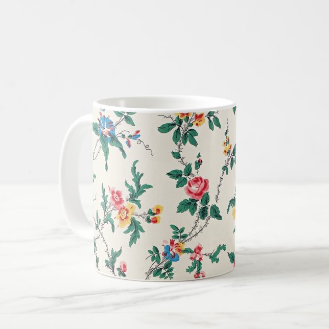 Multicolored flower pattern on white coffee mug (Front Left)