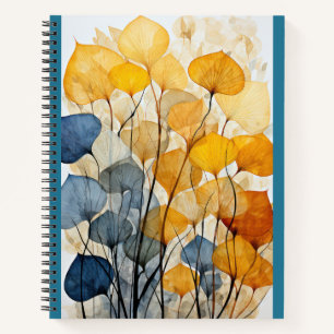 Multicolored Leaves on Blue Notebook