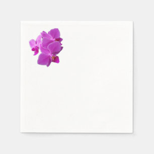 Multiple purple orchids on napkin