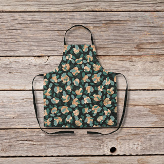 Mushrooms and leafy greens black apron