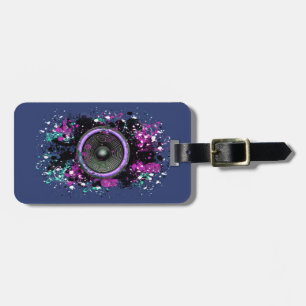 Music speaker and splattered paint luggage tag