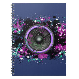 Music speaker and splattered paint notebook