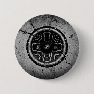 Music speaker on a cracked wall 2 inch round button