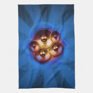 Music speakers and blue sunburst kitchen towel