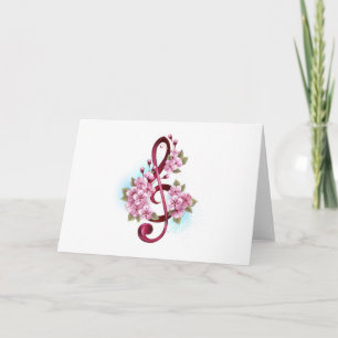 Musical treble clef notes with sakura flowers