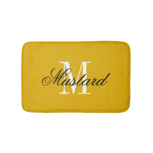 Mustard yellow bath mat with elegant name monogram