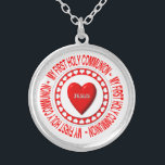 My First Holy Communion Necklace<br><div class="desc">This necklace features a Host surrounded by heats and bearing a "3-D" look heart in the middle with the name of Jesus on it.  Surrounding all this are the words "My First Holy Communion".</div>