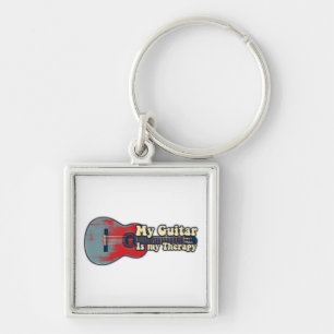 My guitar is my therapy. vintage red and blue keychain