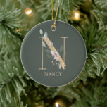 N Monogram Floral Personalized Ceramic Ornament<br><div class="desc">Letter N monogram floral. Letter N in golden brown texture accented with green watercolor compound leaves,  flower blossoms and gold dust. Personalized with name in matching font.</div>