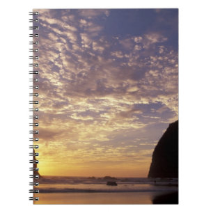 NA, USA, Oregon, Oregon Coast, Canon Beach with Notebook