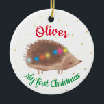 Name Cute Hedgehog Baby First Christmas  Ceramic Ornament<br><div class="desc">Personalized baby first Christmas ornament,  featuring cute decorated hedgehog illustration on a white background,  with small little gold dottie snowflakes. Baby boy or baby girl custom name first Christmas design.</div>