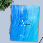 Name Monogram Blue Planner<br><div class="desc">This stylish Planner is decorated with an atmospheric design in shades of blue and turquoise.
Easily customizable with your name, monogram, and year.
Use the Design Tool option to change the text size, style, and colour.</div>