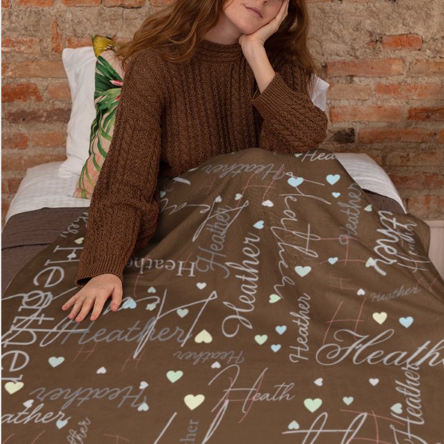 names initials and hearts replicated along brown fleece blanket (Creator Uploaded)