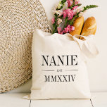 Nanie Roman Numeral Year Established Tote Bag<br><div class="desc">A modern minimalist tote bag to celebrate a chic grandma,  this clean minimal tote features "Nanie" or your choice of grandma nickname in black serif lettering. Customize with the year she became a grandmother beneath in elegant roman numerals for a chic touch.</div>