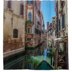 Narrow street with canal in Venice