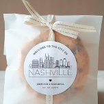Nashville Skyline | Wedding Welcome Favour Classic Round Sticker<br><div class="desc">Enhance your wedding welcome packages or event party favours with a custom set of welcome stickers! These elegant yet minimal-style stickers are tailored for a wedding taking place in the beautiful city of Nashville. They feature a modern deco skyline with the name of the city integrated underneath. All elements of...</div>