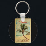 Nassau Palm Tree Vintage Travel Keychain<br><div class="desc">A uniquely retro mid-century modern Nassau Bahamas art print in vintage travel poster style. It features a curved palm tree on sandy beach with ocean under a blue cloudy sky.</div>