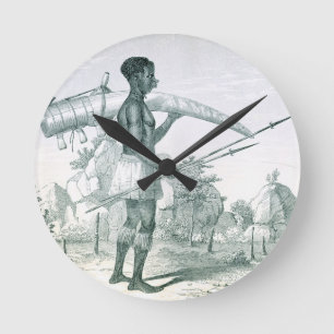 Native carrying a decorated ivory elephant tusk, f round clock