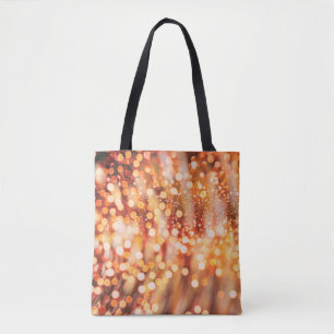 Natural bokeh and bright golden lights tote bag